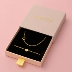 Goudkleurige armband + ketting set met een hart