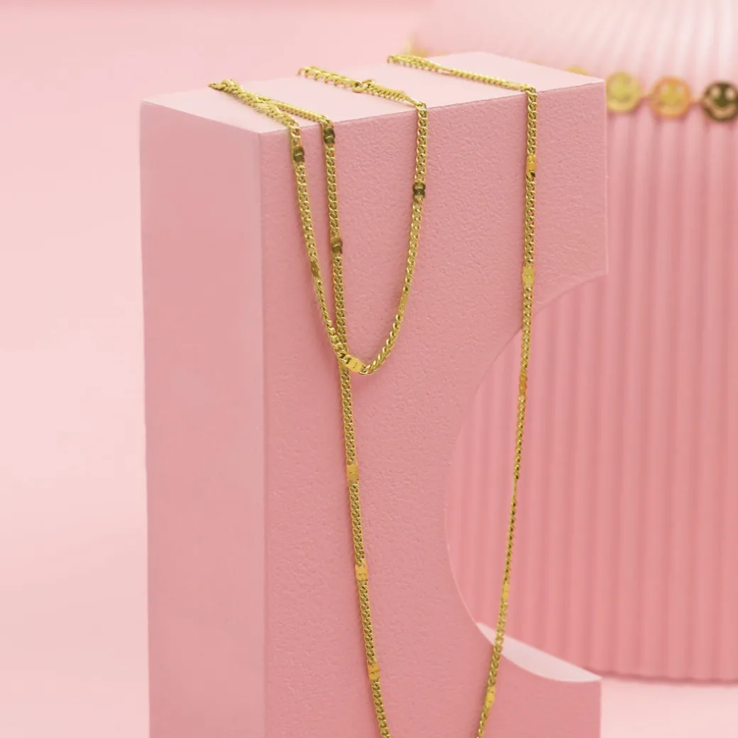 Goudkleurige armband + ketting set met klassiek detail