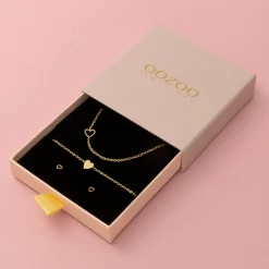 Goudkleurige armband + oorbellen + ketting set met een hart