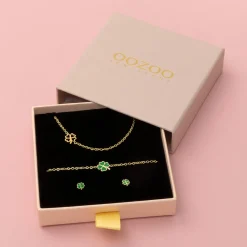Goudkleurige armband + oorbellen + ketting set met een klaver