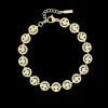 Goudkleurige armband met smileys