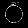 Goudkleurige armband met bolletjes