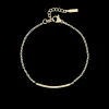 Goudkleurige armband met strass steentjes