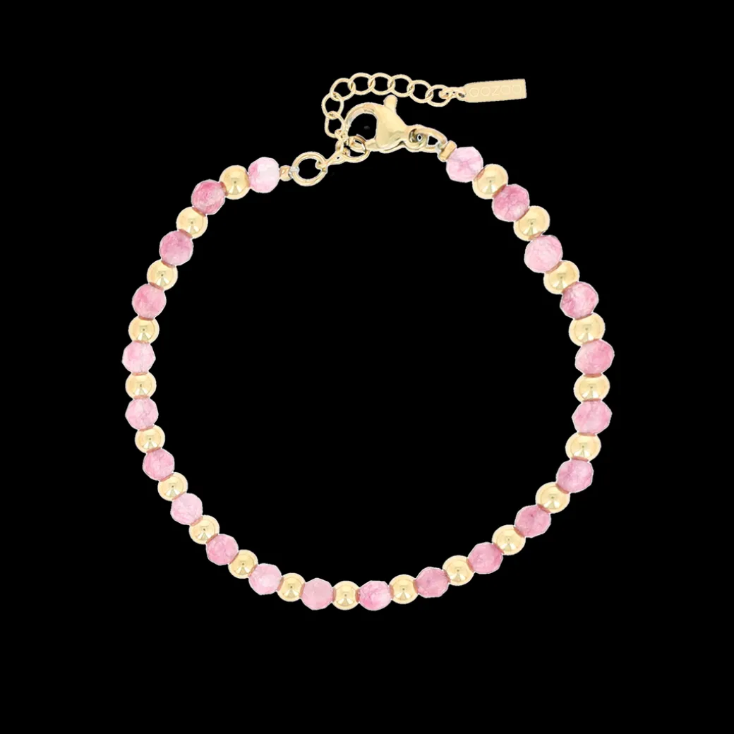 Goudkleurige armband met roze natuursteentjes