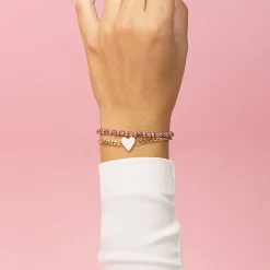 Goudkleurige armband met roze natuursteentjes