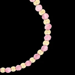 Goudkleurige armband met roze natuursteentjes