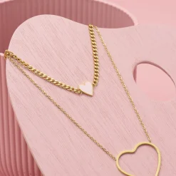 Goudkleurige armband met roze hart bedeltje