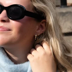 Goudkleurige oorbellen met parels
