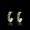 Goudkleurige oorringen met groene strass steentjes