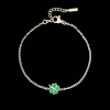 Goudkleurig/groene armband met een klaver