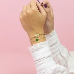 Goudkleurig/groene armband met een klaver