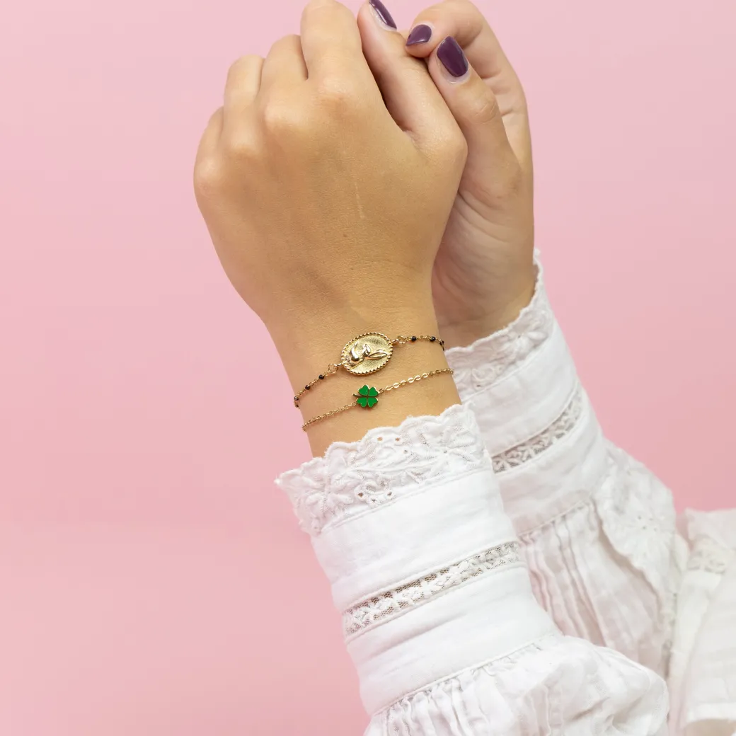 Goudkleurig/groene armband met een klaver