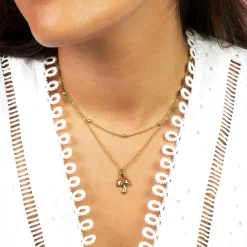 Goudkleurig/rode ketting met een paddenstoel bedeltje