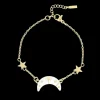 Goudkleurig/witte armband met een maan bedeltje