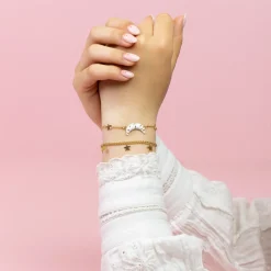 Goudkleurig/witte armband met een maan bedeltje