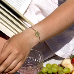 Goudkleurig/zwarte armband met een haas