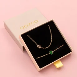 Rosé goud kleurige armband + ketting set met een groene klaver