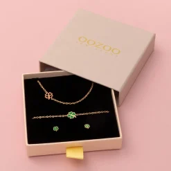 Rosé goud kleurige armband + oorbellen + ketting set met een klaver