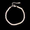 Rosé goudkleurige armband met roze natuursteentjes