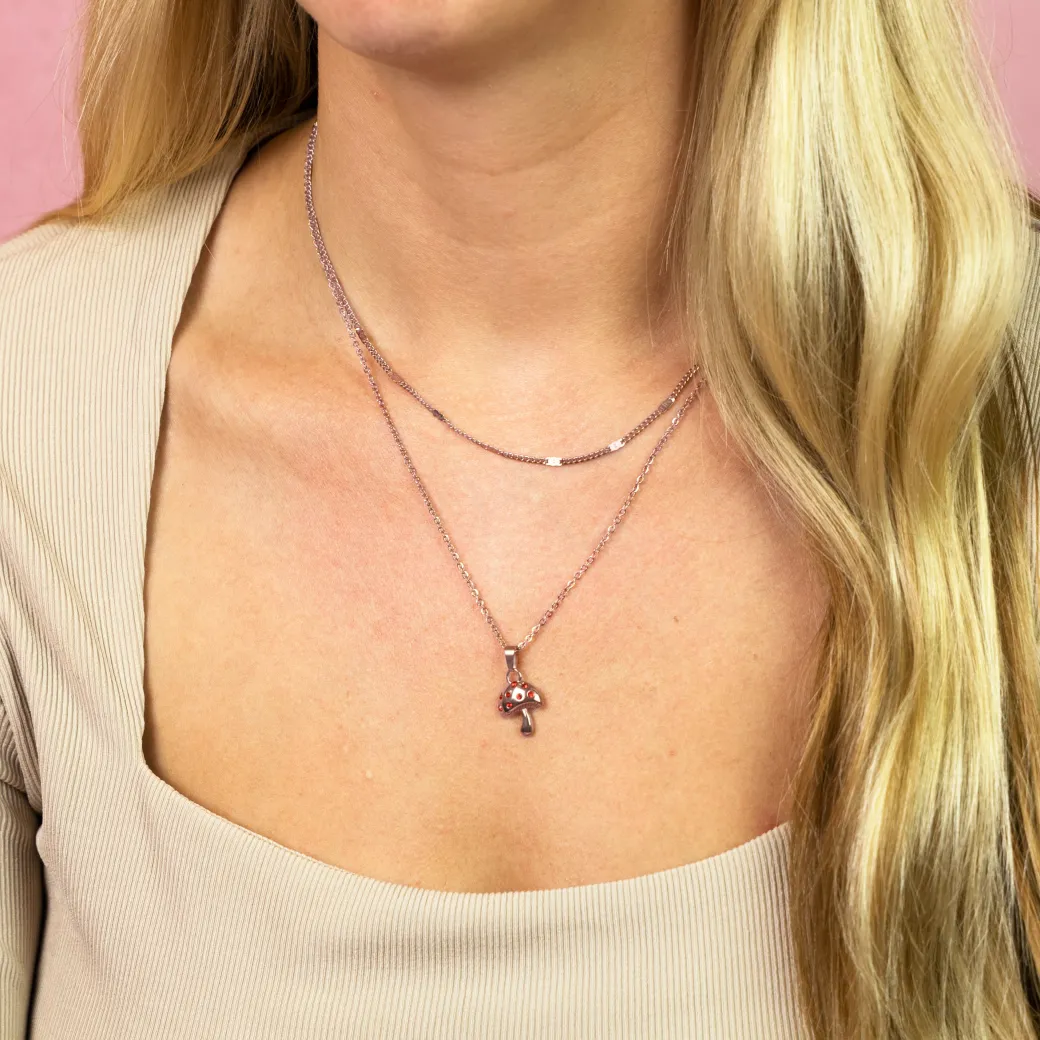 Rosé goudkleurig/rode ketting met een paddenstoel bedeltje