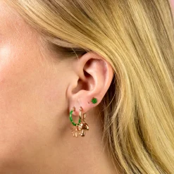 Rosé goudkleurig/rode oorring met een paddenstoel bedeltje