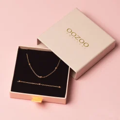 Rosé kleurige armband + ketting set met bolletjes