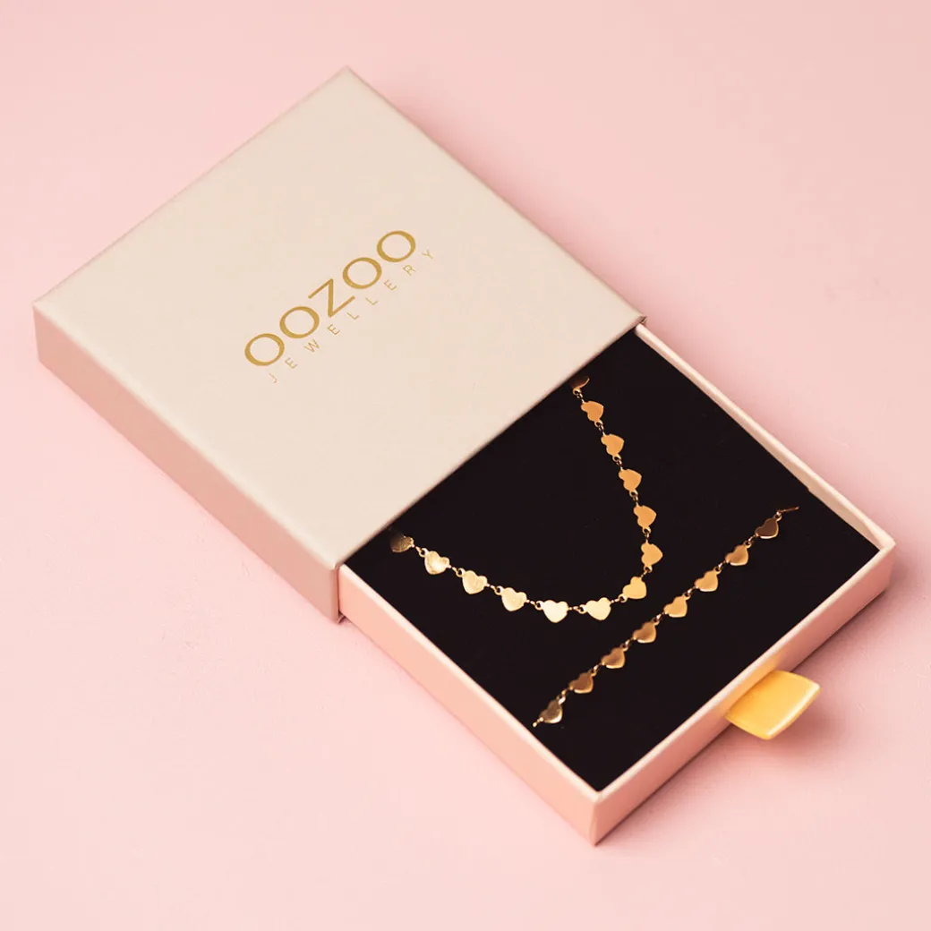 Rosé kleurige armband + ketting set met hartjes