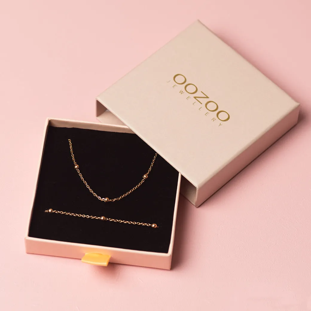 Rosé kleurige armband + ketting set met bolletjes