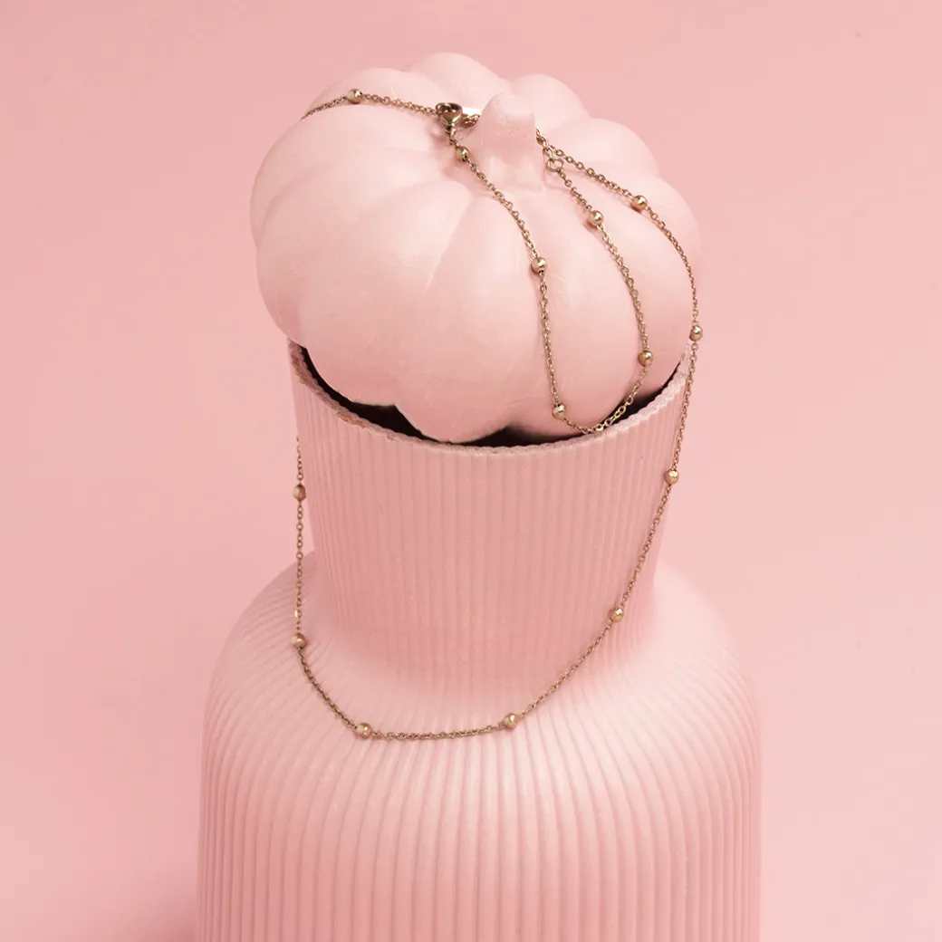 Rosé kleurige armband + ketting set met bolletjes