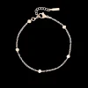 Rosé kleurige armband met bolletjes