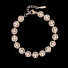 Rosé kleurige armband met smileys