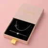 Zilverkleurige armband + ketting set met een hart