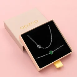 Zilverkleurige armband + ketting set met een groene klaver