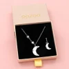 Zilverkleurige oorring + ketting set met een maan bedeltje