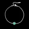 Zilverkleurig/groene armband met een klaver